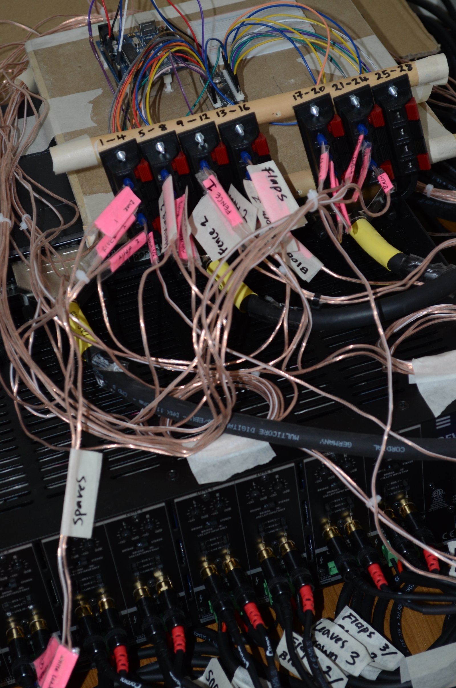 Close-up of conductive wire and audio equipment used in the sculpture