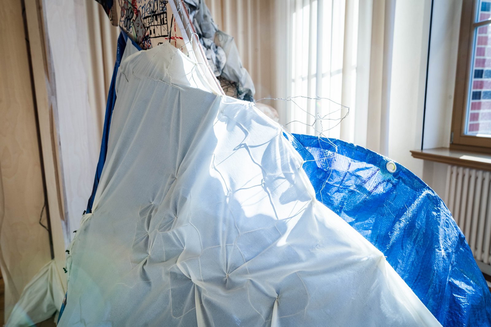 Close-up of blue and white fabric folds on the sculpture